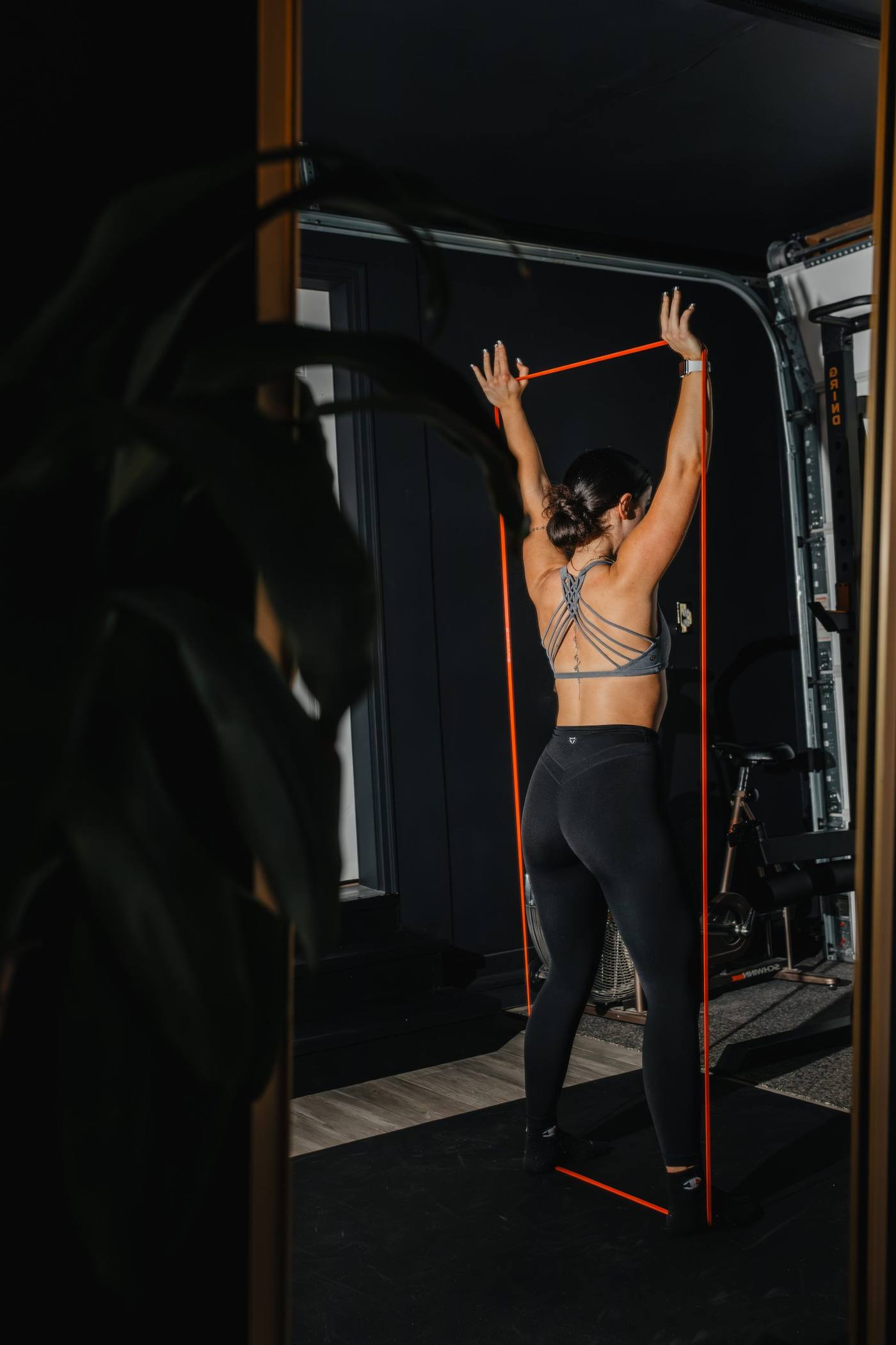A member training in the warm light of the Evolve studio